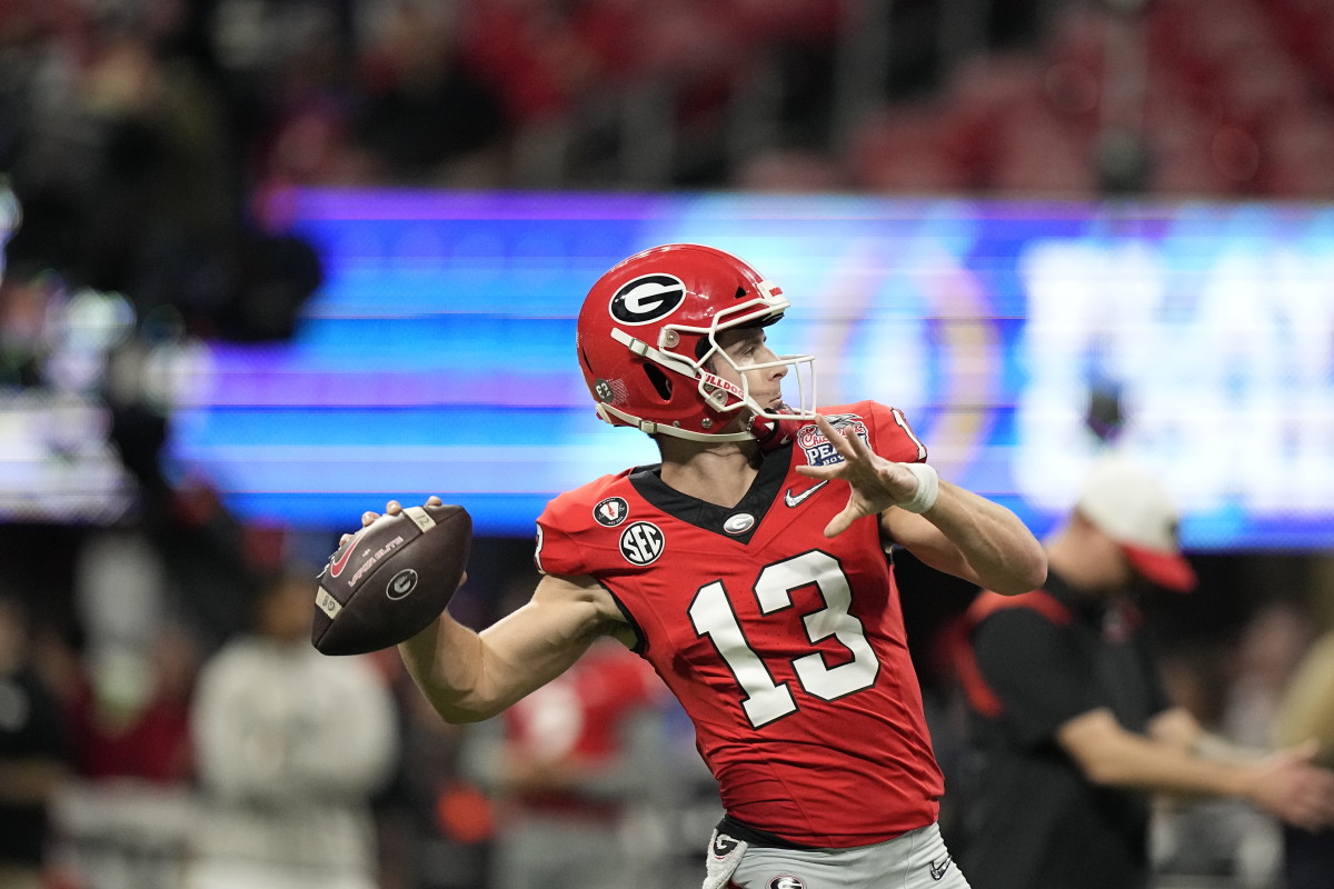 Georgia quarterback Stetson Bennett (13) warms up before the Peach Bowl NCAA college football semifinal playoff game, Saturday, Dec. 31, 2022, in Atlanta. (AP Photo/Brynn Anderson)